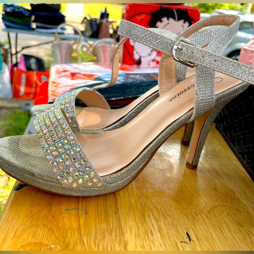 Silver high heels with gems in the front. Size 8. Worn once.